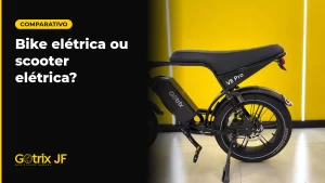 Bicicleta elétrica Gotrix V8 Pro preta, de perfil, em estúdio de fundo amarelo