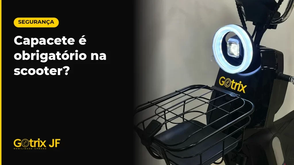 Scooter elétrica Gotrix New Joy preta vista de frente, com cesto dianteiro, em estúdio